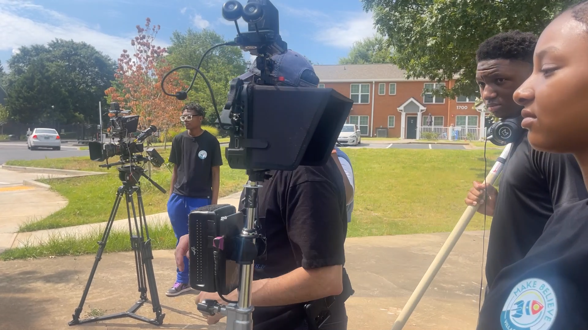 MBV youth crew on location with cinema camera